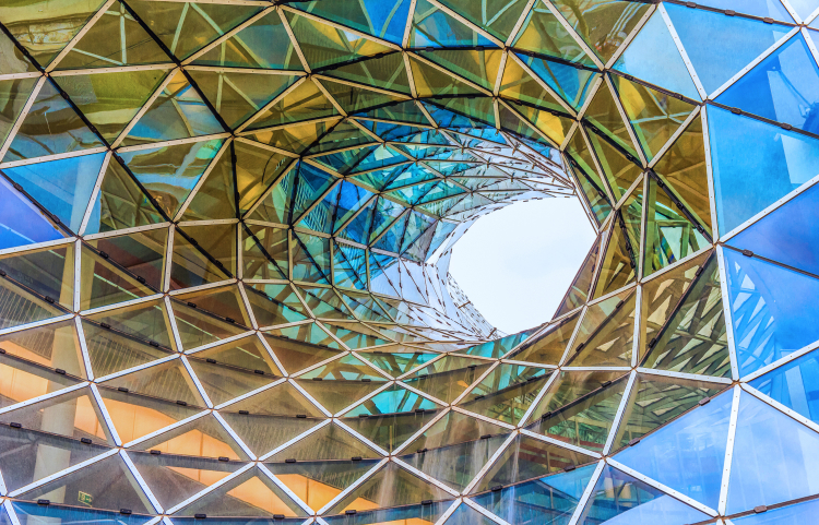 The architectural funnel of MyZeil, consisting of steel beams and triangular glass panels